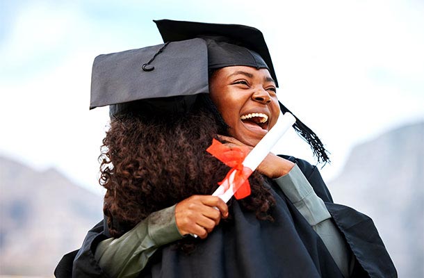 USBA assists military scholars- graduates hugging