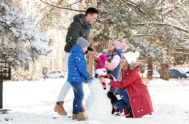 USBA recognizes military traditions and holiday- family building a snowman